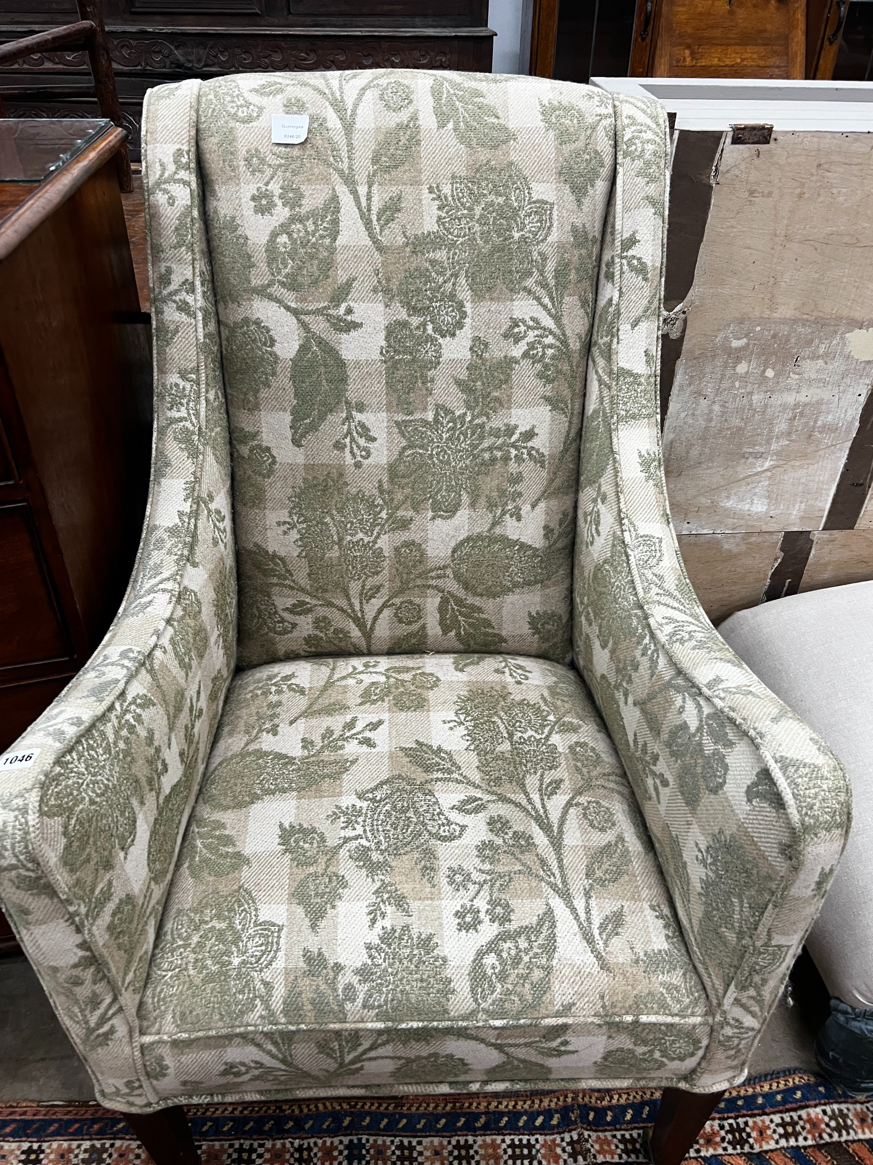 A 19th century wing armchair upholstered in patterned green floral fabric, width 68cm, depth 75cm, height 110cm